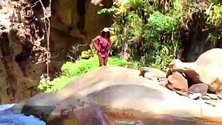 lilyan playing with toys on riverbank