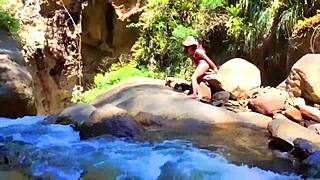 lilyan playing with toys on riverbank