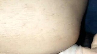 A wife using a large sex toy to pleasure her husband’s anus