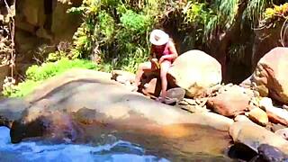 lilyan playing with toys on riverbank