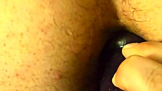 A doggy style position: my curvy MILF wife inserts a dildo slowly into my anus