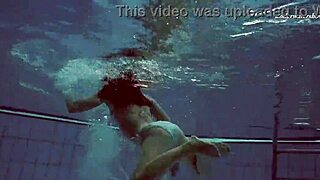 Watch Russian teen Alla swim naked, showing big tits and juicy ass.