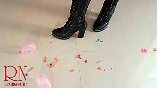 High heels boots burst small balloons in fetish video