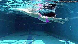 Sinking into the bright sun and the bright spotlight, bikini babe soaks up the male gaze