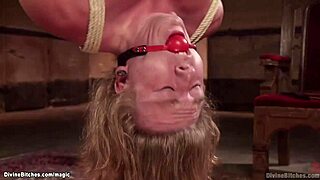 Suspended Man Spanked by Femdom with Strapon?