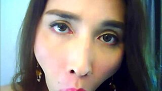 Shemale Babe In Red Boldly Strokes Her Big Shaft