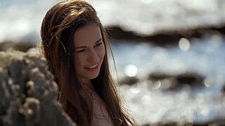 Demi Fray undresses on the beach in a teasing striptease.