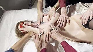 Redhead Leads Wild Orgy with Sensual Handjob Massage