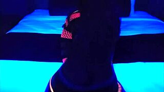 Ebony dancers groove to Plain Jane remix under blacklight