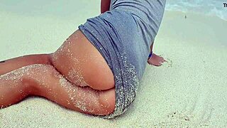 sexy blonde plays with herself by the sea. hot ass in sand?