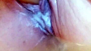 Creamy solo dildoing in wet bathtub pussy