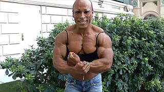 Muscular women with massive biceps dominate the scene, showcasing raw power and femdom control in every flex.