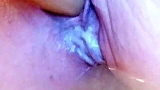 Creamy solo dildoing in wet bathtub pussy