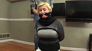 Blonde amateur with natural tits gives intense blowjob. She is bound with rope.