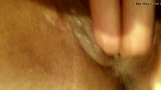 Ebony babe fingers her wet pussy to squirting orgasm