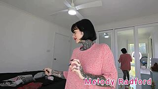 Melody Radford tries on short black skirt showing big tits closeup