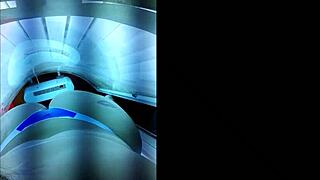 Brazilian slut prepares big ass for lover in tanning booth.