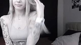 Teen skinny camgirl with tattoos shows her bald pussy on cam