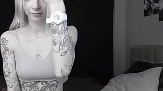 Teen skinny camgirl with tattoos shows her bald pussy on cam