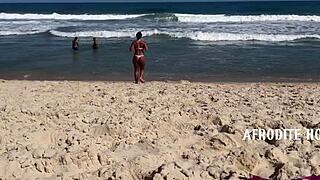 Afrodite sucks dick on the beach.