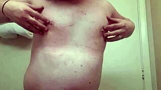 Shemale in panties performs striptease ripping clothes while teasing transsexual crossdressing