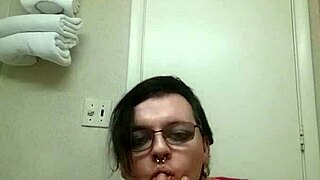 Shemale in panties performs striptease ripping clothes while teasing transsexual crossdressing