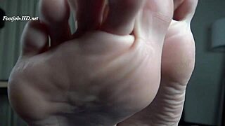 blonde mother in law gives stepson a detailed footjob with her feet on his cock