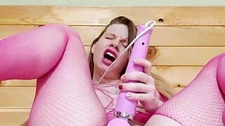 Girl in mesh bodysuit masturbating pussy with vibrator