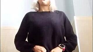 A sexy babe in a miniskirt smokes in a private setting.