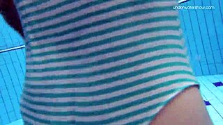 The Russian beauty, Anna Netrebko in a stripy swimsuit gives a small tit show