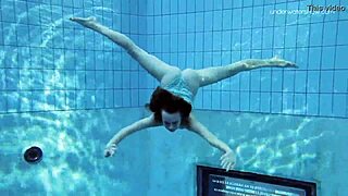 The Russian beauty, Anna Netrebko in a stripy swimsuit gives a small tit show