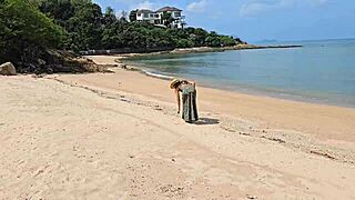 sexy babe in long dress flashes no panties on public beach close-up.