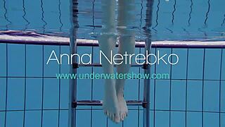 The Russian beauty, Anna Netrebko in a stripy swimsuit gives a small tit show