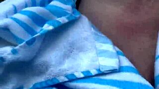 Beautiful babe with big natural tits enjoys playful action in the pool.