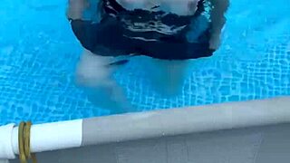 Beautiful babe with big natural tits enjoys playful action in the pool.