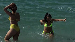 A threesome with a black bull and a cowgirl at the beach