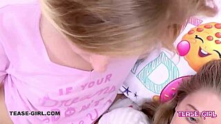 Oh, these blonde teens are kissing passionately on the sofa!