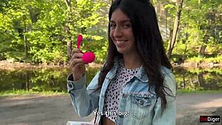 Cute girlfriend gets off with vibrator in public park
