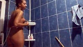 two women enjoy a relaxing shower together