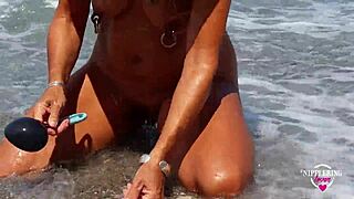 Nipple piercing lover gets naughty on the beach