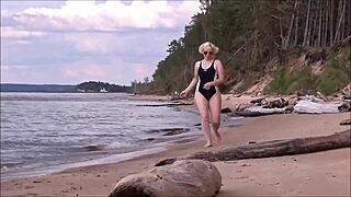 blonde amateur charges at sea in costume after workout