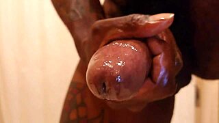 Hallelujah Johnson uses lubricant while masturbating her big black cock