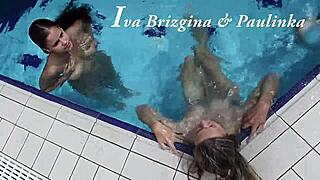 Iva Brizgina and Paulinka dive into hot softcore lesbian play in the pool.