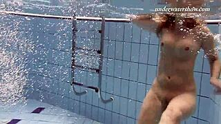 Iva Brizgina and Paulinka dive into hot softcore lesbian play in the pool.