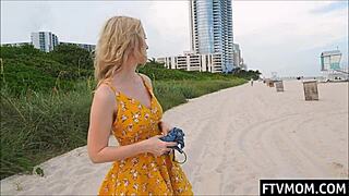 Hot MILF flashes bikini body in public beach display.