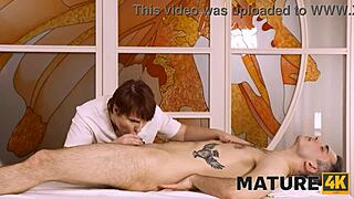 Mature woman and client having fun in massage parlor.