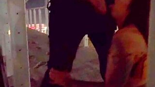 Lovebirds have sex on a bridge over the water