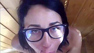Hot babe with glasses gets face splattered with cum