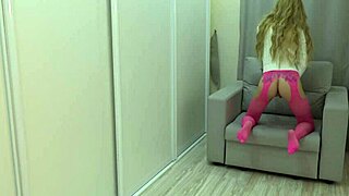 passionate girl in pantyhose gently plays with her tight pussy using huge dildo