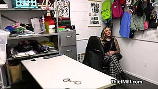 Busty tattoo artist in office milks police officer's dick with her hands